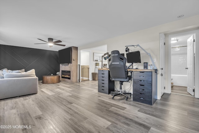 235 Willow Ln, Forked River, NJ 08731 - office with wood finished floors, a fireplace, and a ceiling fan