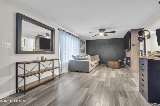 235 Willow Ln, Forked River, NJ 08731 - living room featuring a ceiling fan, wood finished floors, and an accent wall