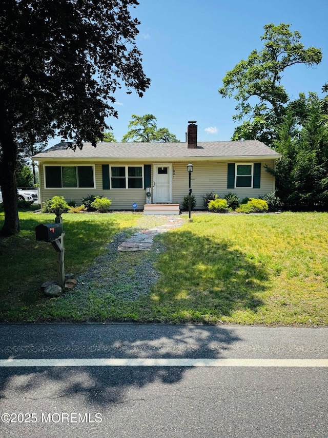1601 Beacon St, Toms River, NJ 08757 - ranch-style home featuring a chimney and a front lawn
