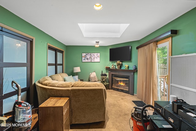 207 Lloyd Rd, Matawan, NJ 07747 - living area featuring a skylight, a glass covered fireplace, and light carpet