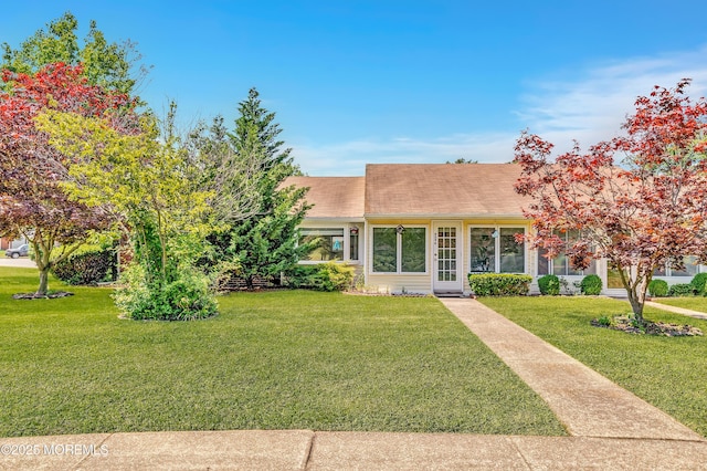 404 Picardy Ct Unit A, Lakewood, NJ 08701 - view of front facade featuring a front lawn and roof with shingles