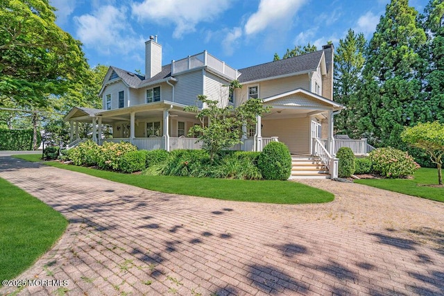 1905 3rd Ave, Spring Lake, NJ 07762 - view of front of house with a chimney, covered porch, and a front lawn