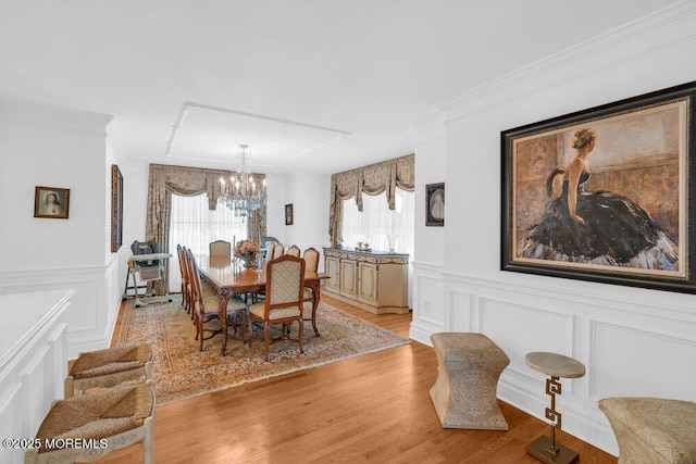 1905 3rd Ave, Spring Lake, NJ 07762 - dining room with a decorative wall, a chandelier, ornamental molding, light wood-style flooring, and wainscoting