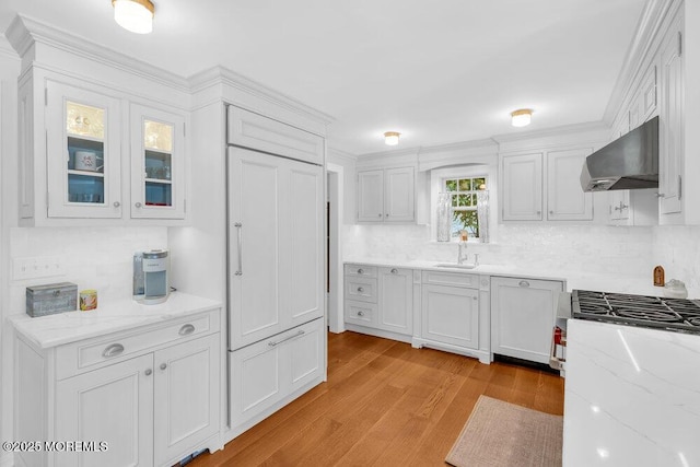 1905 3rd Ave, Spring Lake, NJ 07762 - kitchen with wall chimney exhaust hood, tasteful backsplash, white cabinets, light wood finished floors, and light stone countertops