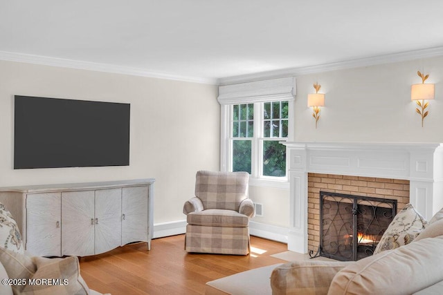 1905 3rd Ave, Spring Lake, NJ 07762 - living area featuring wood finished floors, a brick fireplace, and ornamental molding