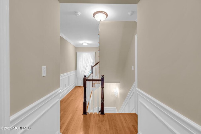 1905 3rd Ave, Spring Lake, NJ 07762 - hallway featuring an upstairs landing, a decorative wall, a wainscoted wall, ornamental molding, and light wood-style floors