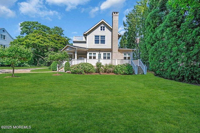 1905 3rd Ave, Spring Lake, NJ 07762 - view of front facade featuring stairs, a chimney, and a front yard