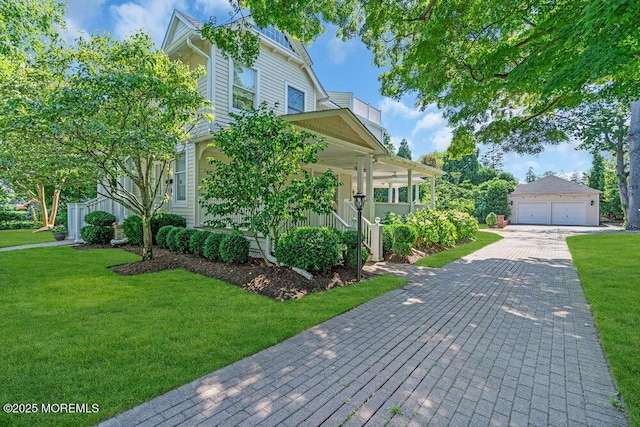 1905 3rd Ave, Spring Lake, NJ 07762 - view of front of home featuring an outdoor structure, covered porch, a front lawn, and a detached garage