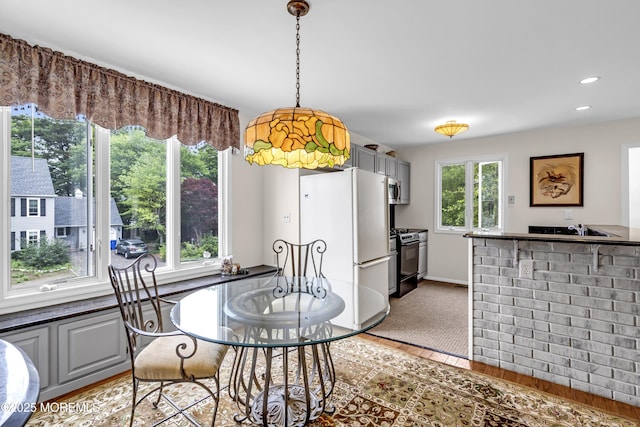 35 Tahoe Ln, Stafford, NJ 08050 - dining space with light wood finished floors, recessed lighting, and bar area