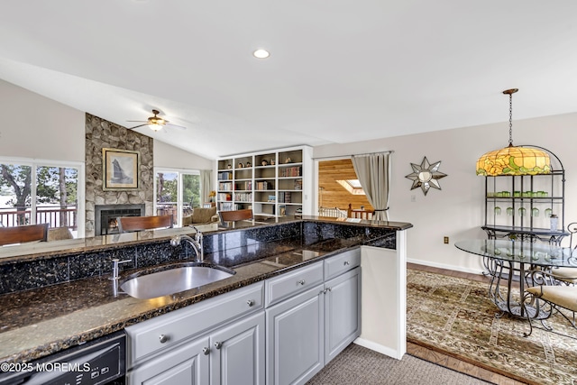 35 Tahoe Ln, Stafford, NJ 08050 - kitchen featuring black dishwasher, a ceiling fan, a large fireplace, lofted ceiling, and open floor plan