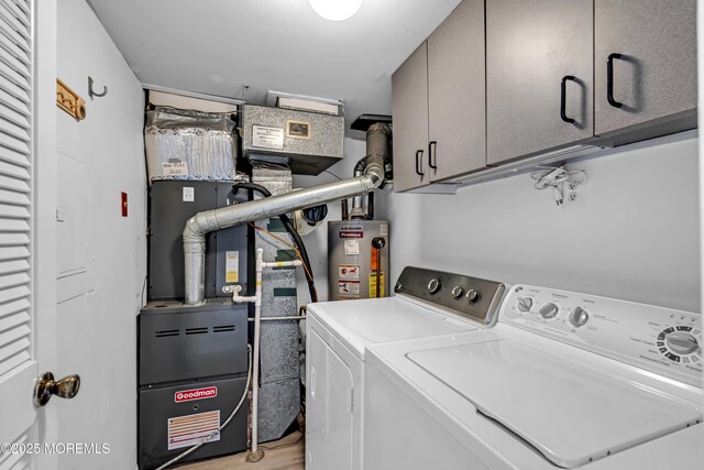35 Tahoe Ln, Stafford, NJ 08050 - laundry area featuring water heater, cabinet space, and separate washer and dryer