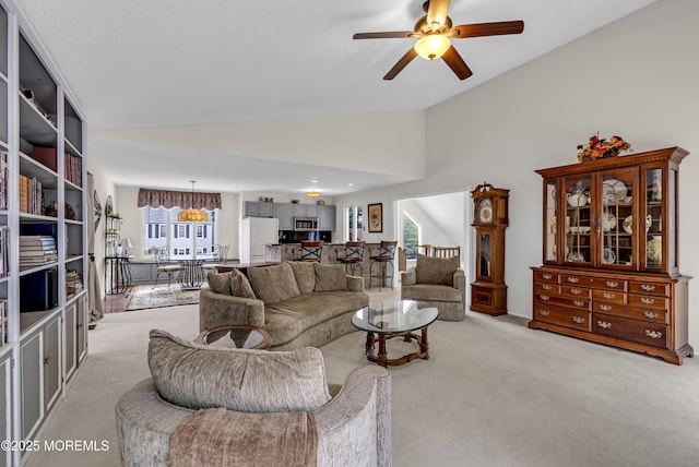 35 Tahoe Ln, Stafford, NJ 08050 - living area with light colored carpet, ceiling fan, plenty of natural light, and high vaulted ceiling