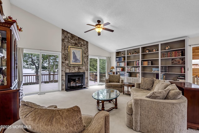35 Tahoe Ln, Stafford, NJ 08050 - living room featuring a ceiling fan, carpet flooring, a fireplace, a textured ceiling, and high vaulted ceiling