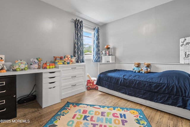 243 Donald Ave, Rahway, NJ 07065 - bedroom featuring wood-type flooring and a wainscoted wall