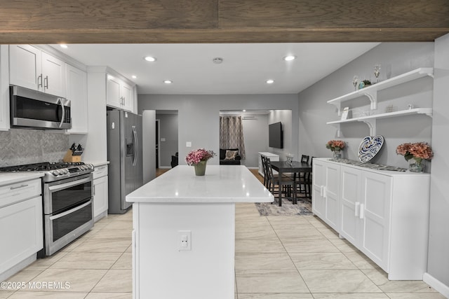 243 Donald Ave, Rahway, NJ 07065 - kitchen with appliances with stainless steel finishes, recessed lighting, a center island, light countertops, and decorative backsplash