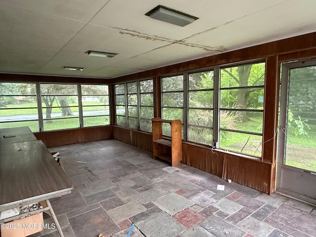 34 Woodbrook Cir, Westfield, NJ 07090 - unfurnished sunroom featuring healthy amount of natural light, wooden walls, and stone tile floors