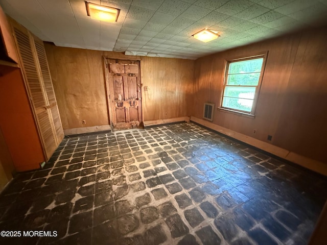 34 Woodbrook Cir, Westfield, NJ 07090 - unfurnished bedroom with wooden walls and baseboards