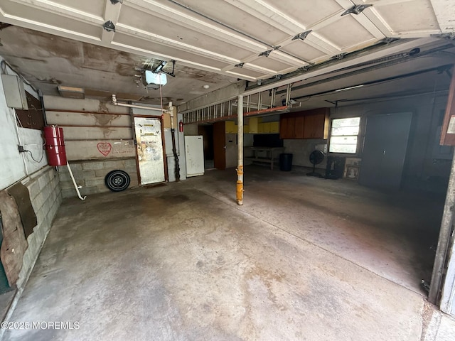34 Woodbrook Cir, Westfield, NJ 07090 - garage featuring a garage door opener and a central vacuum unit