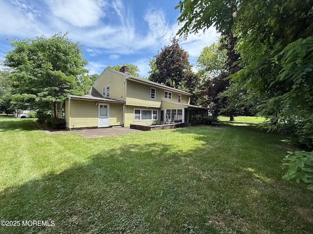 34 Woodbrook Cir, Westfield, NJ 07090 - rear view of house featuring a chimney and a yard