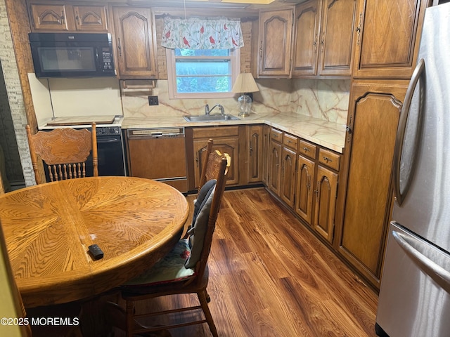 34 Woodbrook Cir, Westfield, NJ 07090 - kitchen with freestanding refrigerator, black microwave, dishwasher, light countertops, and dark wood-style flooring