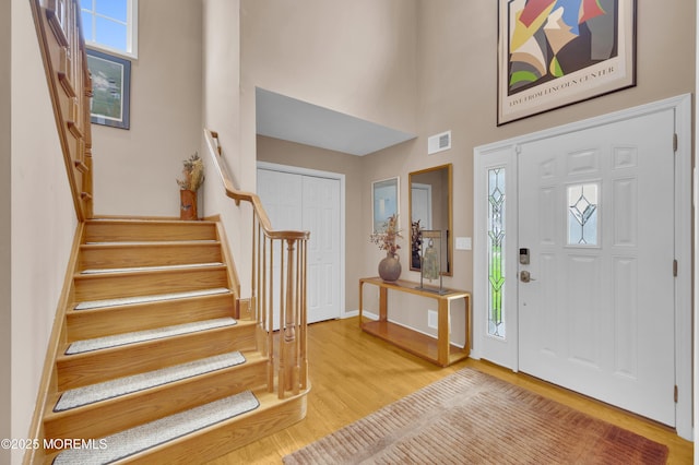 12 Diane Dr, Brick, NJ 08724 - entrance foyer featuring wood finished floors, stairs, and a towering ceiling