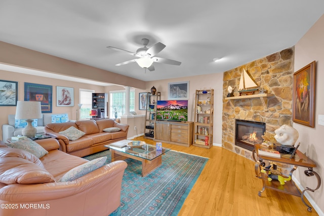 12 Diane Dr, Brick, NJ 08724 - living area with a fireplace, ornate columns, a ceiling fan, and wood finished floors