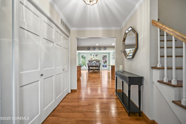 6 Stoecker Rd, Holmdel, NJ 07733 - corridor with wood finished floors, stairs, and crown molding
