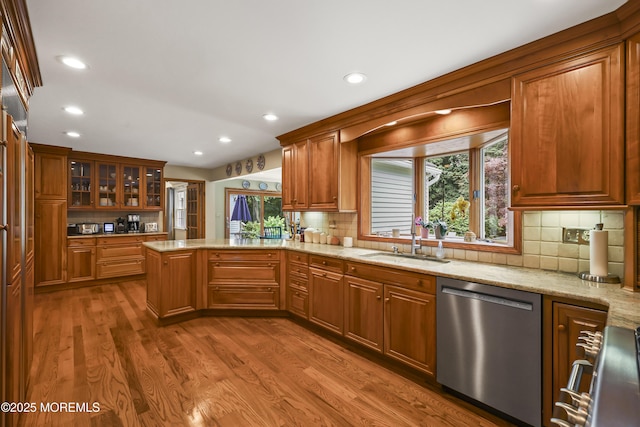 6 Stoecker Rd, Holmdel, NJ 07733 - kitchen featuring stainless steel dishwasher, a peninsula, light stone countertops, wood finished floors, and healthy amount of natural light