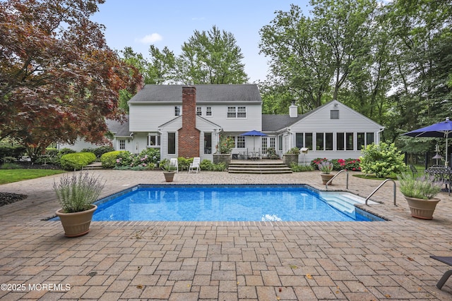 6 Stoecker Rd, Holmdel, NJ 07733 - outdoor pool with a wooden deck and a patio area