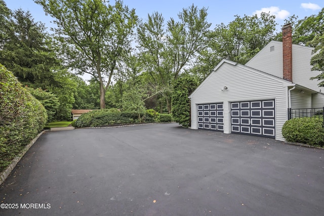 6 Stoecker Rd, Holmdel, NJ 07733 - garage featuring asphalt driveway