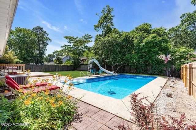 455 Drum Point Rd, Brick, NJ 08723 - view of pool with a water slide, a fenced backyard, a patio, and view of wooded area