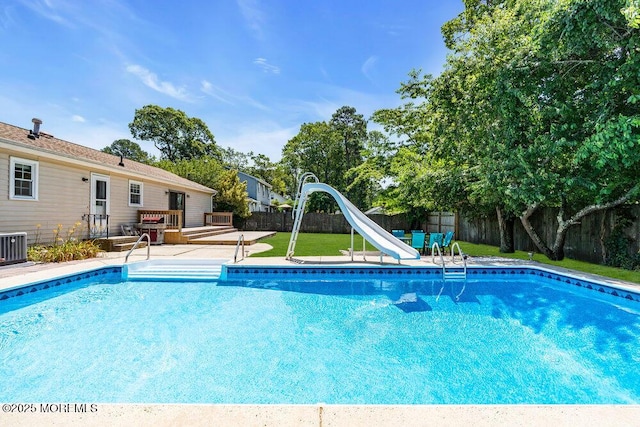 455 Drum Point Rd, Brick, NJ 08723 - view of pool with a water slide, a fenced backyard, and a wooden deck