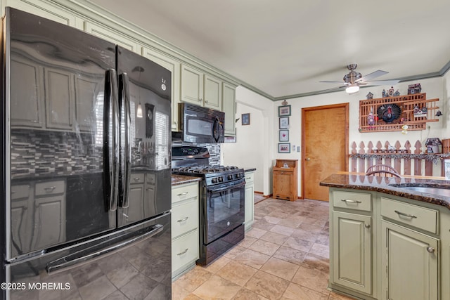 414 Riverview Rd, Forked River, NJ 08731 - kitchen with black appliances, a ceiling fan, green cabinetry, dark stone counters, and tasteful backsplash