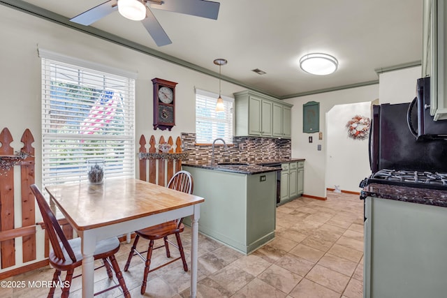 414 Riverview Rd, Forked River, NJ 08731 - kitchen featuring green cabinets, ceiling fan, tasteful backsplash, decorative light fixtures, and stainless steel microwave