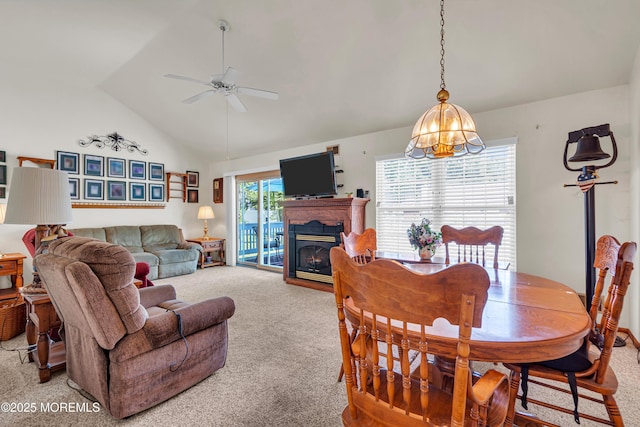 414 Riverview Rd, Forked River, NJ 08731 - dining room with carpet, ceiling fan, a chandelier, a glass covered fireplace, and high vaulted ceiling