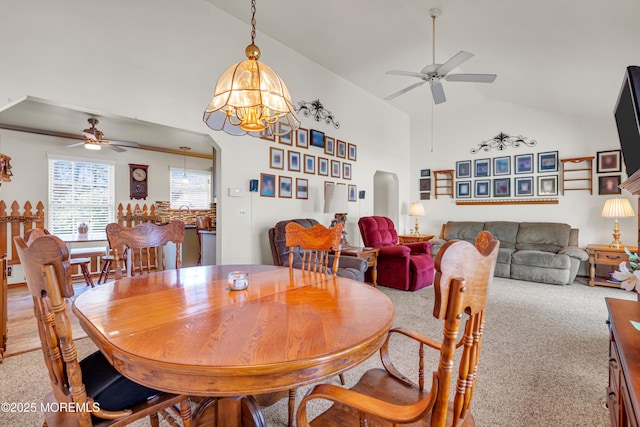 414 Riverview Rd, Forked River, NJ 08731 - dining area featuring ceiling fan, arched walkways, light carpet, a chandelier, and high vaulted ceiling