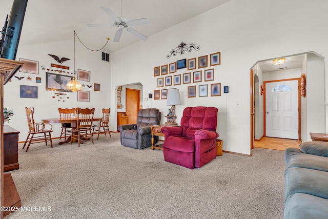 414 Riverview Rd, Forked River, NJ 08731 - living room featuring carpet, high vaulted ceiling, arched walkways, and a ceiling fan