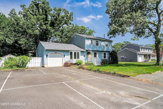 343 Clifton Ave, Bayville, NJ 08721 - colonial home featuring a garage and concrete driveway
