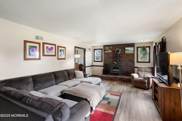 343 Clifton Ave, Bayville, NJ 08721 - living room featuring a wood stove and wood finished floors