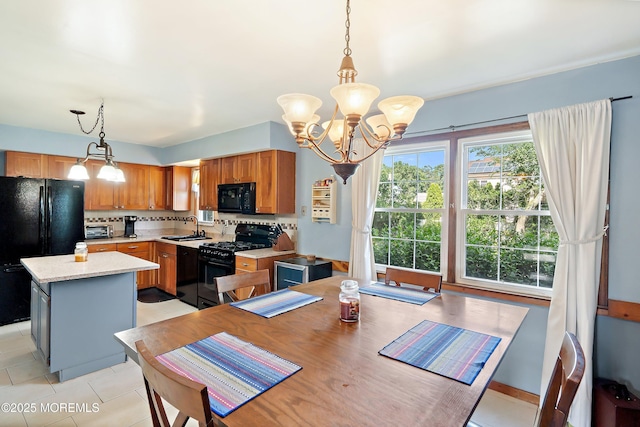 343 Clifton Ave, Bayville, NJ 08721 - dining room with a chandelier and light tile patterned floors