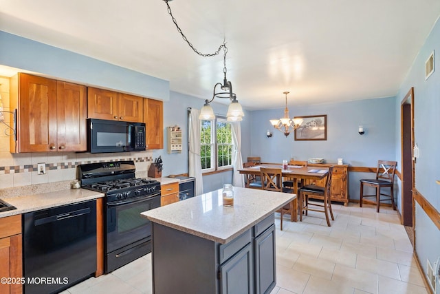 343 Clifton Ave, Bayville, NJ 08721 - kitchen with black appliances, decorative backsplash, a chandelier, brown cabinetry, and light tile patterned flooring