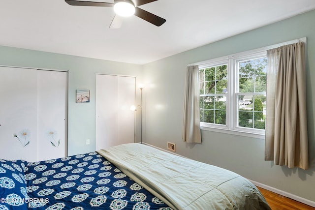 343 Clifton Ave, Bayville, NJ 08721 - bedroom featuring wood finished floors, ceiling fan, and multiple closets
