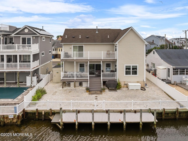 164 Morris Blvd, Beach Haven West, NJ 08050 - back of property featuring a fenced backyard, a deck with water view, and a residential view