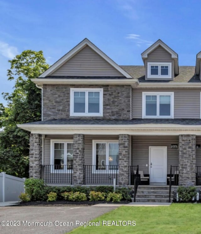 7 Regal Ct, Lakewood, NJ 08701 - view of front of home with a porch and stone siding