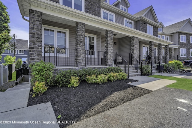 7 Regal Ct, Lakewood, NJ 08701 - multi unit property featuring a porch and stone siding