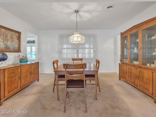 136 Georgetown Rd, Toms River, NJ 08757 - dining room featuring a chandelier and light carpet