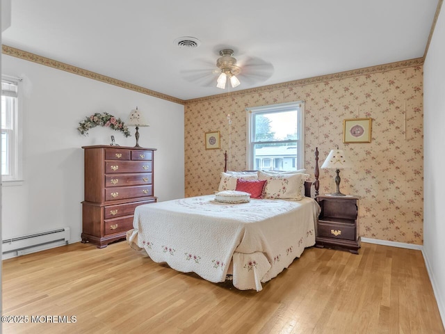 136 Georgetown Rd, Toms River, NJ 08757 - bedroom featuring a baseboard radiator, light wood-type flooring, wallpapered walls, and a ceiling fan