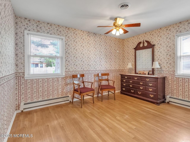 136 Georgetown Rd, Toms River, NJ 08757 - sitting room featuring baseboard heating, light wood-style flooring, wallpapered walls, and a ceiling fan