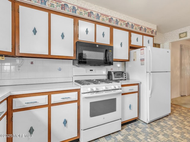 136 Georgetown Rd, Toms River, NJ 08757 - kitchen featuring white appliances, light countertops, tasteful backsplash, white cabinets, and wallpapered walls