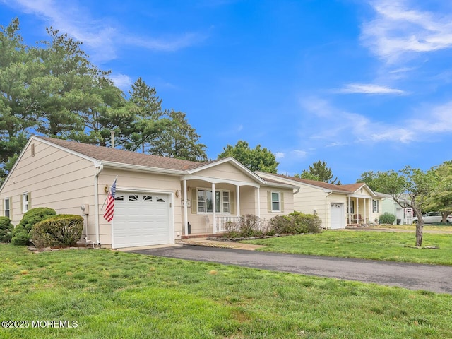 136 Georgetown Rd, Toms River, NJ 08757 - single story home with a garage, driveway, a front lawn, and covered porch